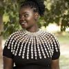 An authentic cowrie shell necklace that can be worn with any outfit.